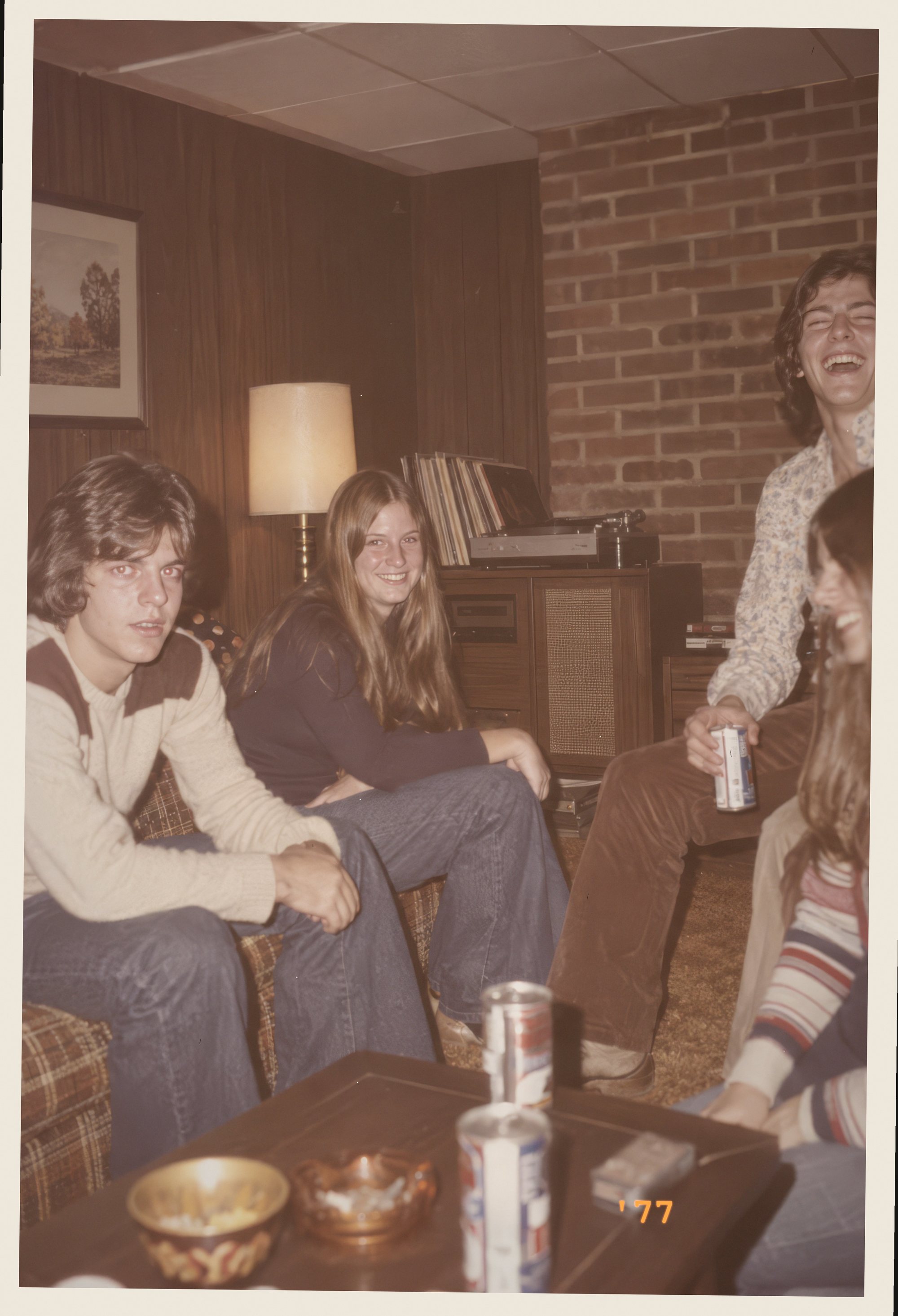 Teenagers in a wood-paneled basement