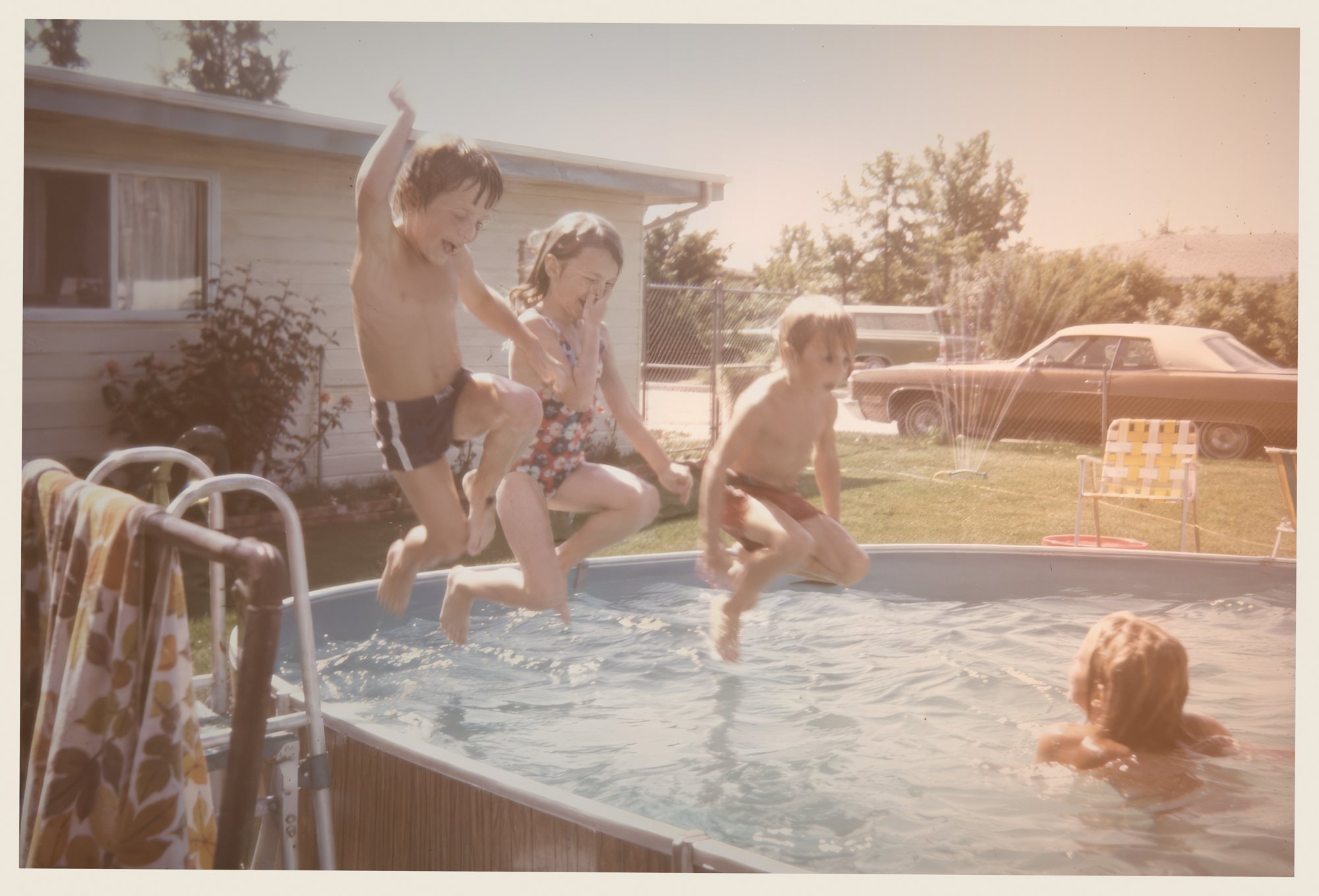 Backyard above-ground pool, summer